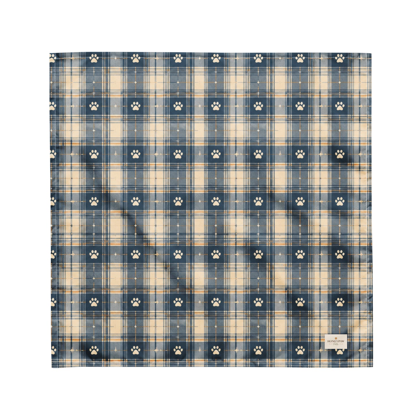 Tailwinds dog bandana featuring a navy blue plaid pattern with paw prints by HoneyPaw Pets