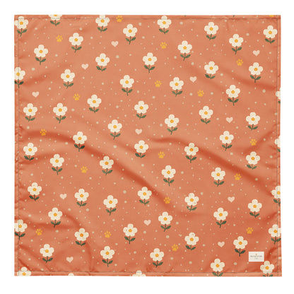 Terracotta Paws dog bandana featuring cream floral blooms, golden paw prints, and tiny hearts on a terracotta background by HoneyPaw Pets.