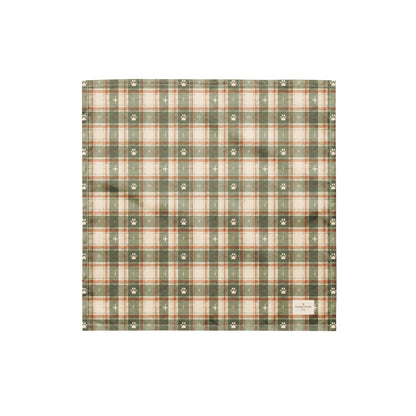 Trail Buddy dog bandana featuring a green plaid pattern with paw prints by HoneyPaw Pets.