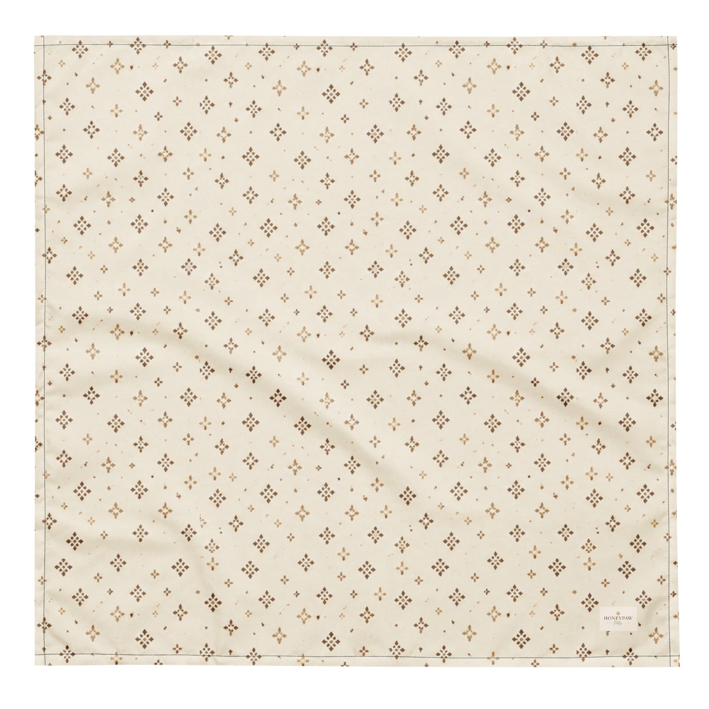 Tumbleweed Tails dog bandana featuring a cream background with a subtle western-inspired geometric pattern in warm tan tones by HoneyPaw Pets.