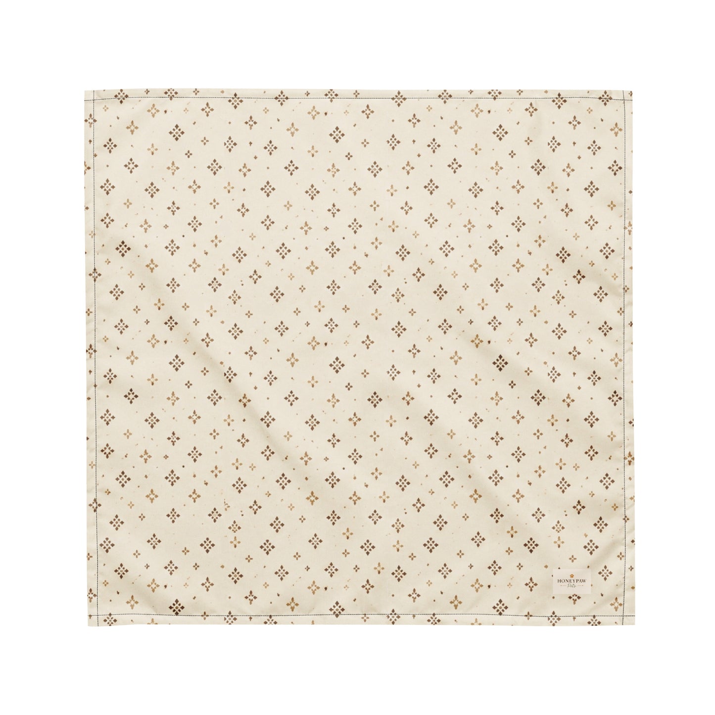 Tumbleweed Tails dog bandana featuring a cream background with a subtle western-inspired geometric pattern in warm tan tones by HoneyPaw Pets.