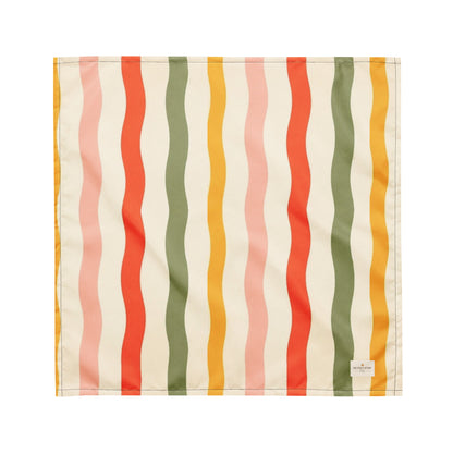 Tutti Frutti dog bandana featuring playful wavy stripes in coral, sage green, blush pink, and golden yellow on a cream background by HoneyPaw Pets.