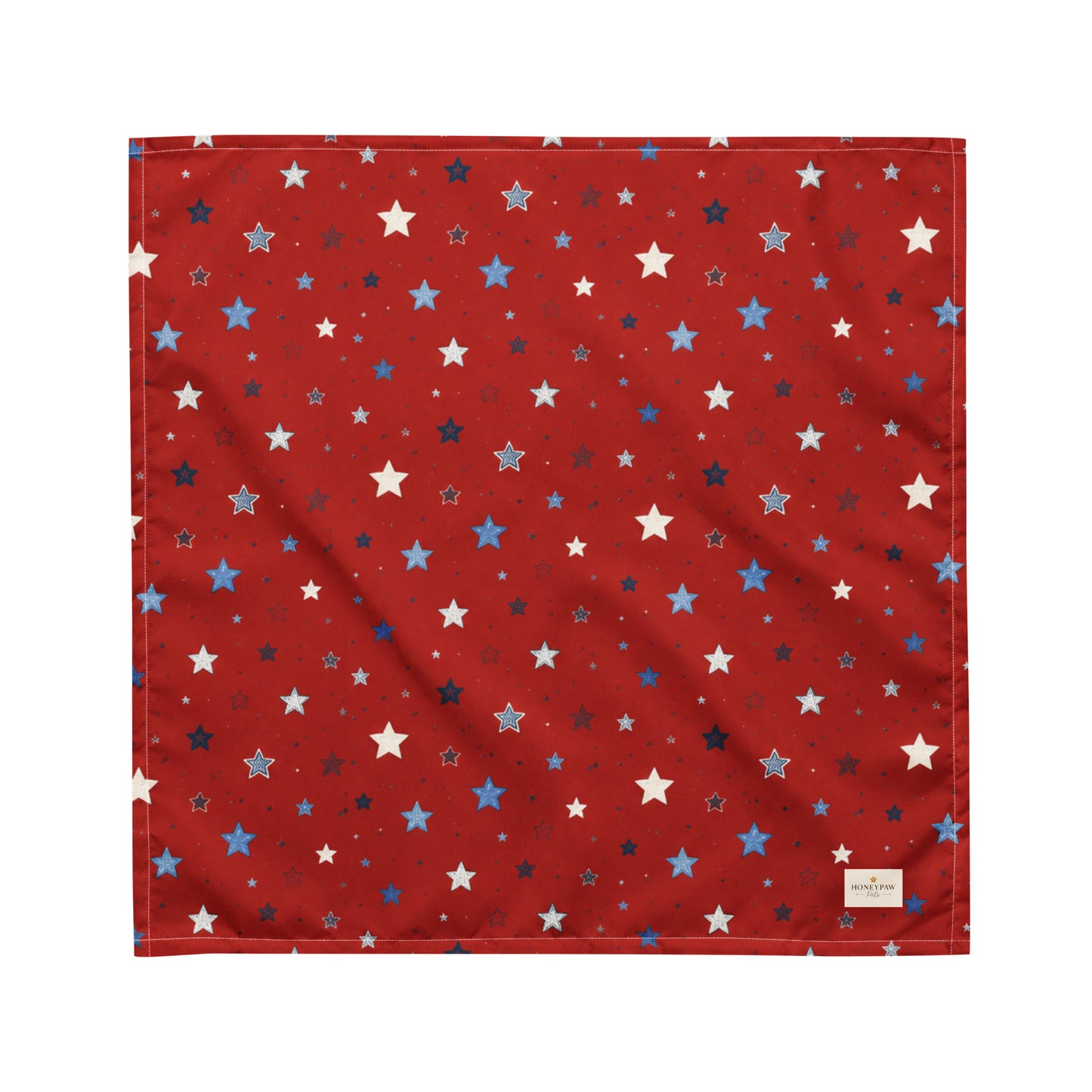 Twinkle Tails dog bandana featuring a patriotic star pattern on a red background by HoneyPaw Pets